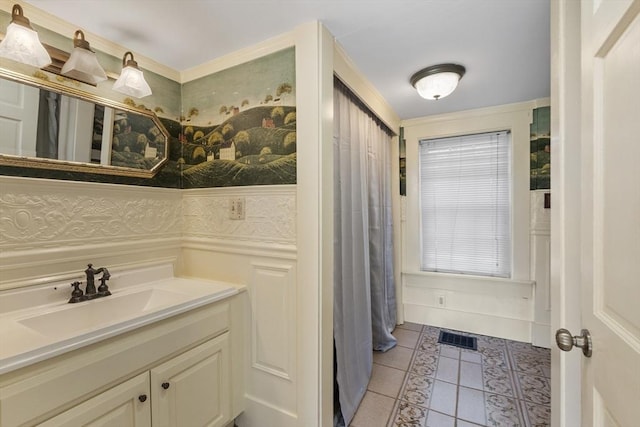 bathroom with visible vents, a wainscoted wall, tile patterned flooring, and vanity