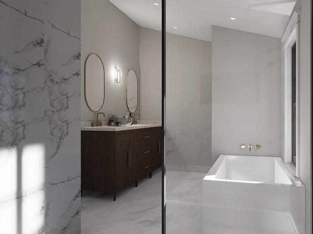 bathroom with vanity and a bath