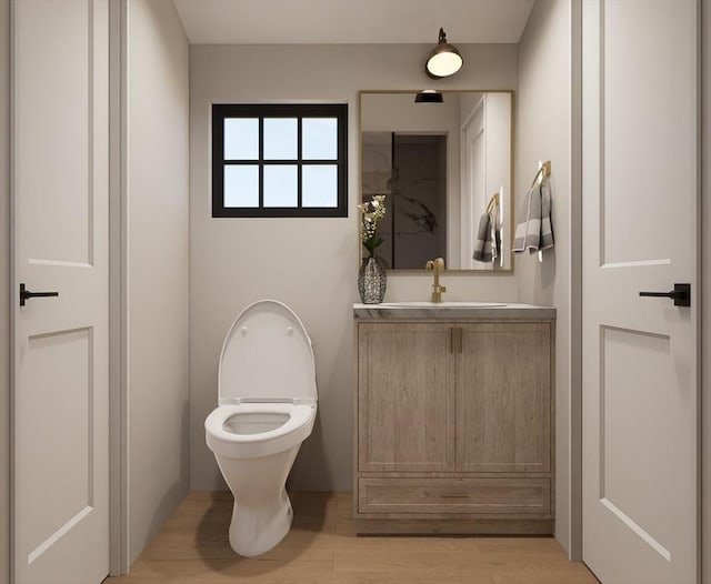 bathroom featuring wood-type flooring, vanity, and toilet