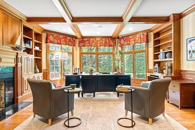 interior space featuring light wood finished floors, beamed ceiling, coffered ceiling, and built in features