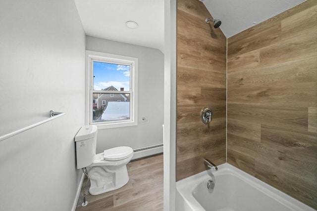 bathroom with a baseboard heating unit, hardwood / wood-style floors, washtub / shower combination, and toilet