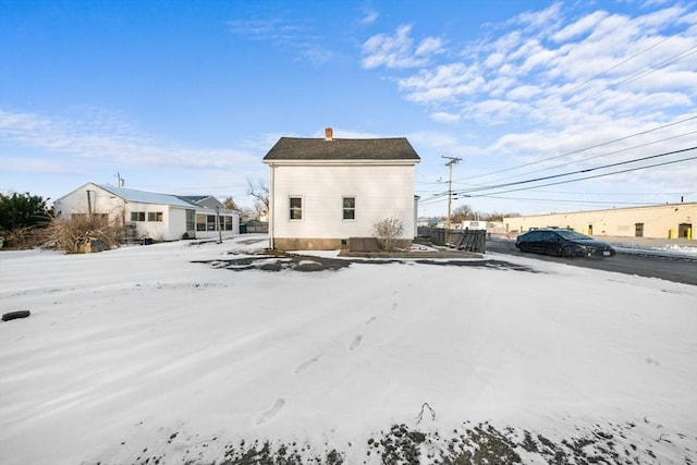 view of snow covered house