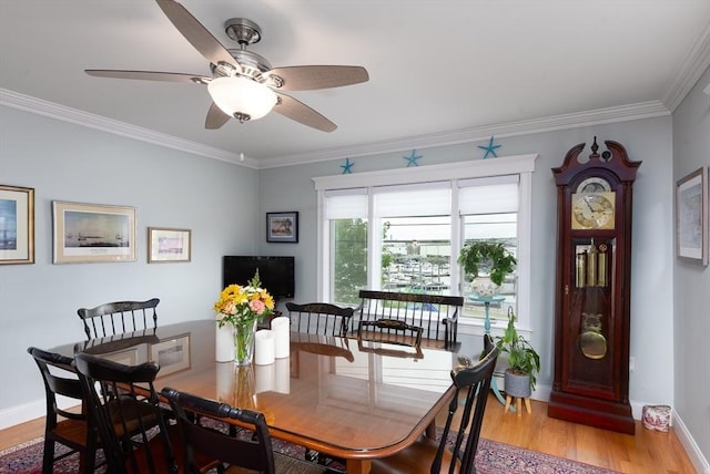 74 E Main St Unit 3, Gloucester, MA 01930 - dining space featuring light wood-style floors, ornamental molding, baseboards, and a ceiling fan