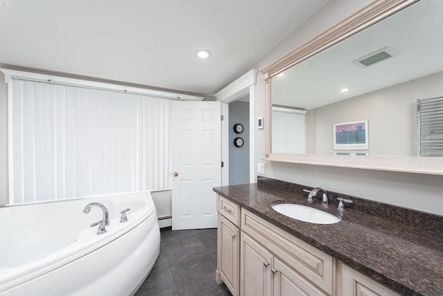 74 E Main St Unit 3, Gloucester, MA 01930 - bathroom with vanity, a garden tub, recessed lighting, and baseboard heating