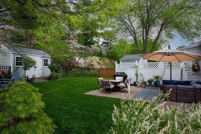 74 E Main St Unit 3, Gloucester, MA 01930 - view of yard featuring outdoor lounge area, an outbuilding, and a patio area