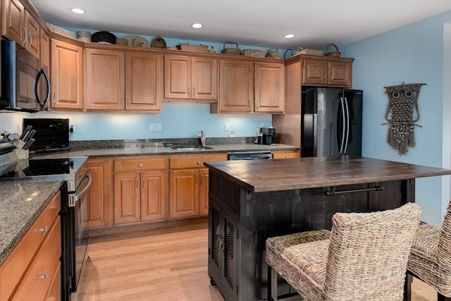 74 E Main St Unit 3, Gloucester, MA 01930 - kitchen featuring black appliances, a sink, wooden counters, light wood-style floors, and recessed lighting