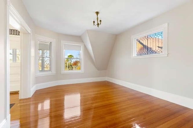 4-6 W St, Arlington, MA 02476 - additional living space featuring wood finished floors, baseboards, and lofted ceiling