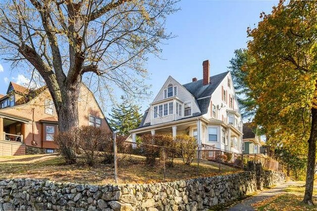 4-6 W St, Arlington, MA 02476 - view of property exterior featuring a chimney and a gambrel roof