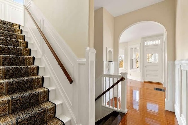 4-6 W St, Arlington, MA 02476 - stairs featuring arched walkways and wood finished floors