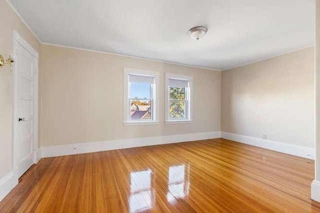 4-6 W St, Arlington, MA 02476 - empty room featuring light wood-style flooring, ornamental molding, and baseboards