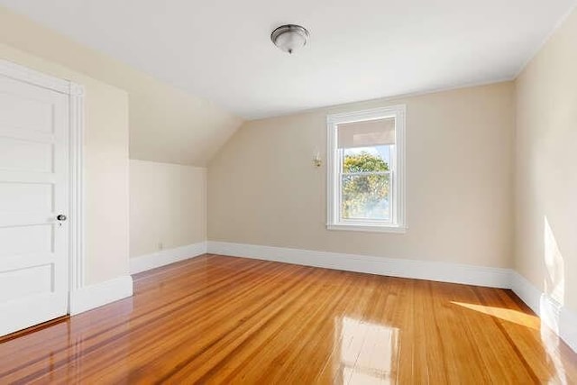 4-6 W St, Arlington, MA 02476 - additional living space featuring light wood-type flooring, baseboards, and lofted ceiling