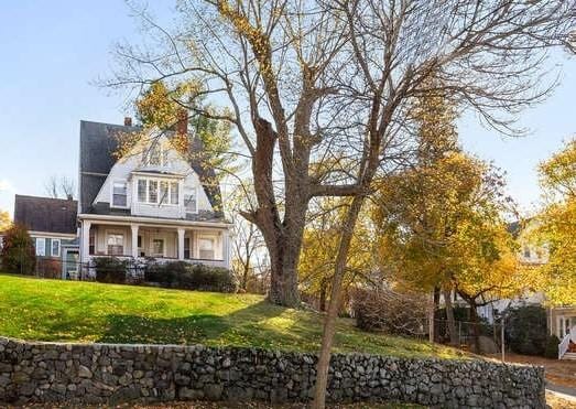 4-6 W St, Arlington, MA 02476 - shingle-style home featuring a front yard and covered porch