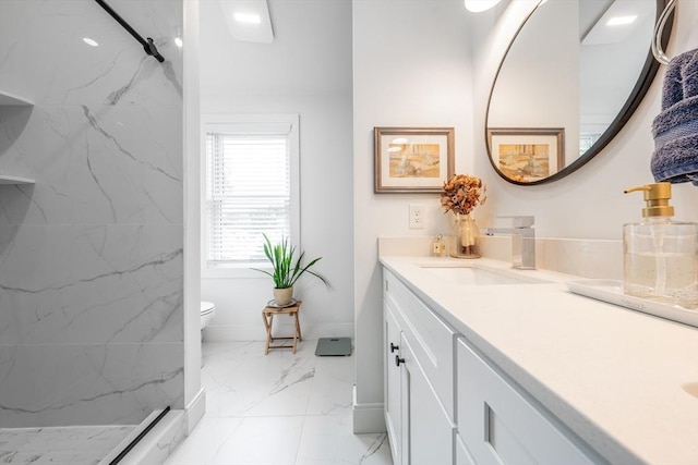 16 Walker St Unit 16, Medford, MA 02155 - full bathroom with marble look tile flooring, double vanity, baseboards, and a marble finish shower