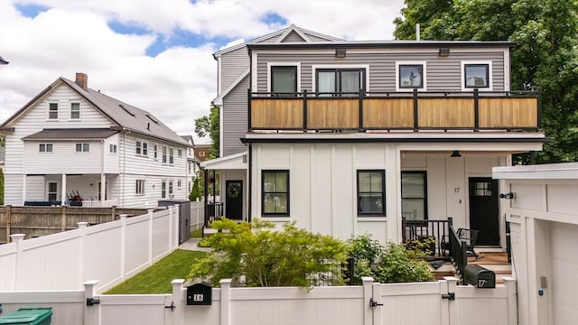 16 Walker St Unit 16, Medford, MA 02155 - view of front of property with a gate, a balcony, and a fenced front yard