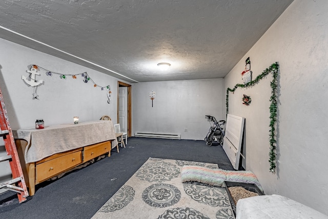 bedroom with a textured ceiling and baseboard heating