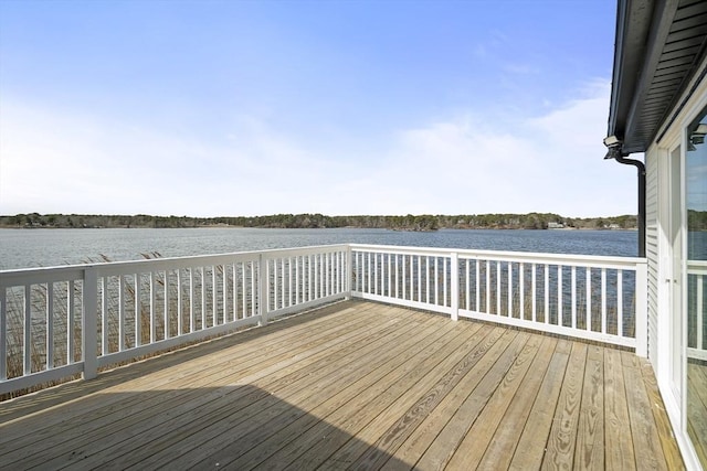 dock area featuring a deck with water view