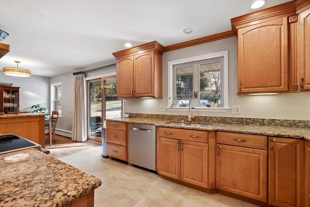 kitchen featuring dishwasher, light stone counters, plenty of natural light, and a sink