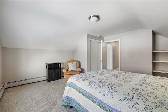 bedroom with lofted ceiling, a closet, baseboard heating, a baseboard heating unit, and light carpet