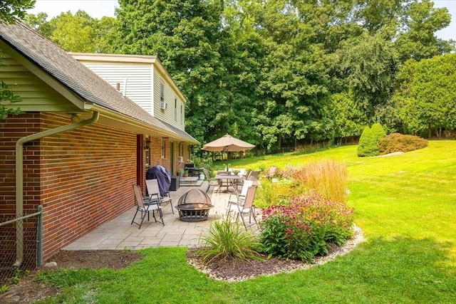 view of yard with a patio area and a fire pit