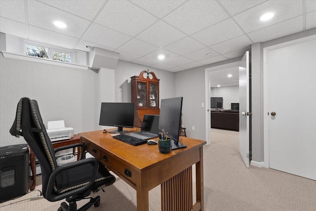 office featuring a paneled ceiling, recessed lighting, and light colored carpet