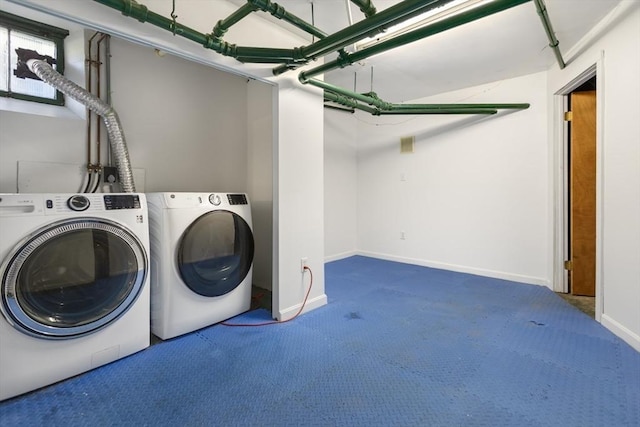 laundry room with carpet flooring, independent washer and dryer, and baseboards