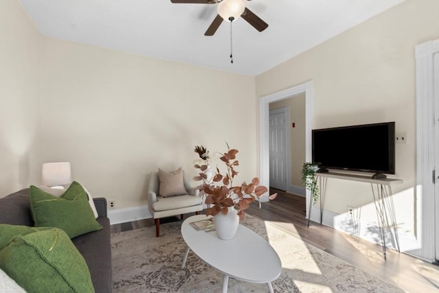 living room with hardwood / wood-style floors and ceiling fan