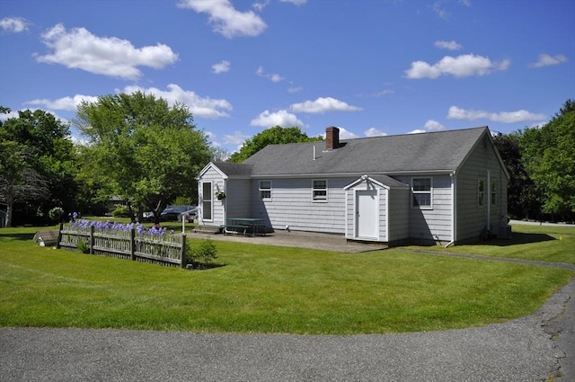 706 Washington St, East Bridgewater, MA 02333 - back of property with a patio, a chimney, entry steps, and central AC unit