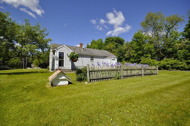 706 Washington St, East Bridgewater, MA 02333 - rear view of property with a chimney