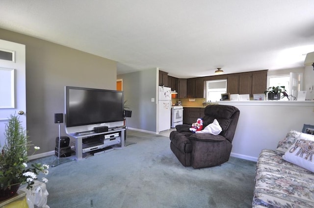 706 Washington St, East Bridgewater, MA 02333 - living area with baseboards and light colored carpet