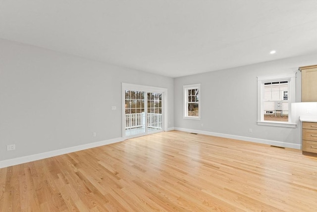 27 Leonard St Unit 27, Bridgewater, MA 02324 - unfurnished living room featuring light wood finished floors and recessed lighting