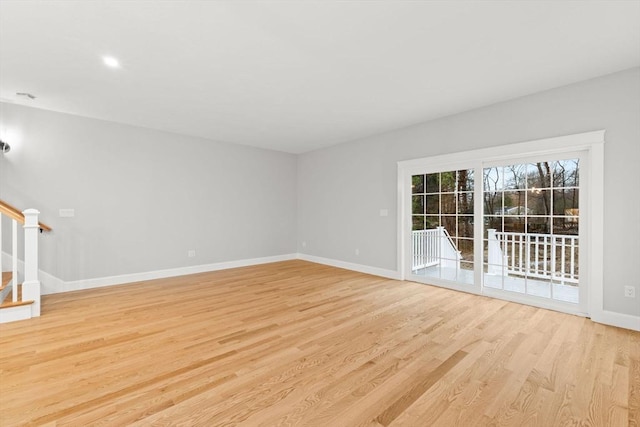 27 Leonard St Unit 27, Bridgewater, MA 02324 - empty room featuring light wood finished floors, stairway, and recessed lighting