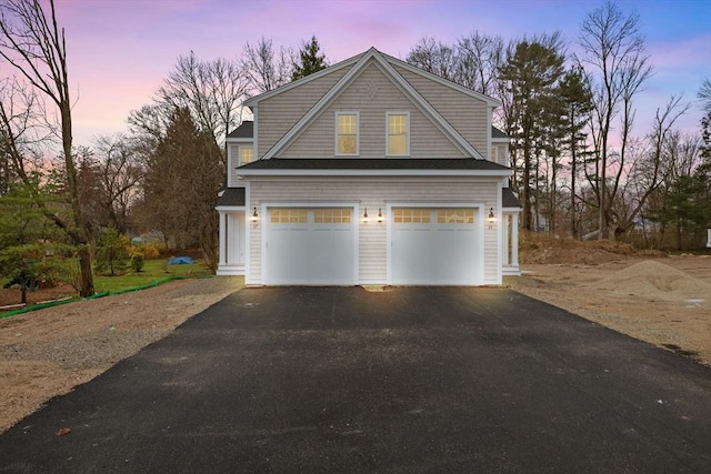 27 Leonard St Unit 27, Bridgewater, MA 02324 - view of front facade with driveway and an attached garage