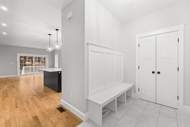 27 Leonard St Unit 27, Bridgewater, MA 02324 - mudroom with baseboards and light wood-style floors