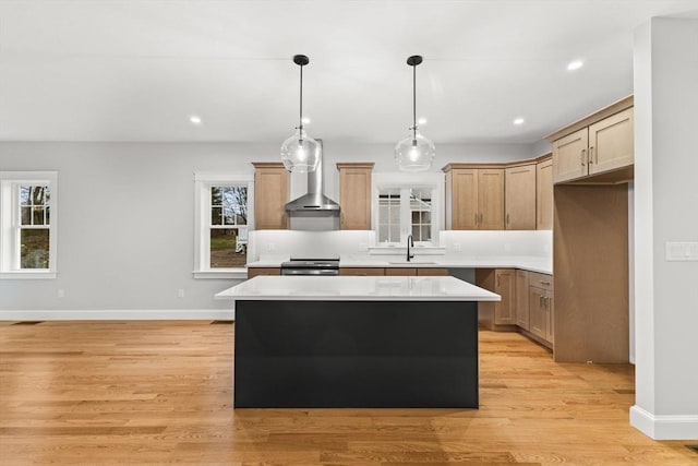 27 Leonard St Unit 27, Bridgewater, MA 02324 - kitchen with electric stove, a kitchen island, light countertops, light wood-type flooring, and wall chimney exhaust hood