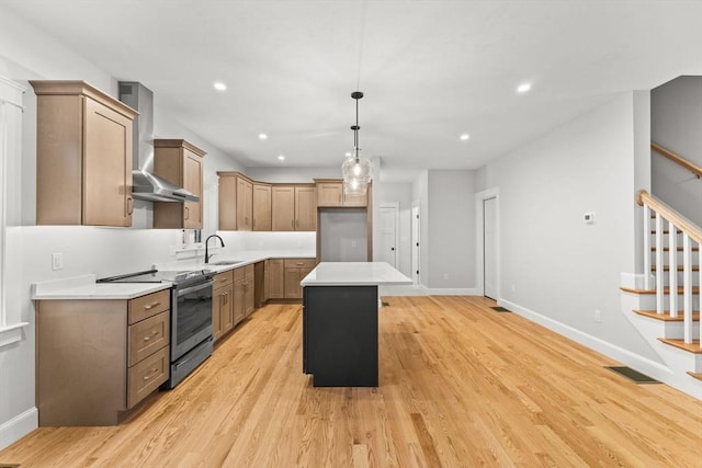 27 Leonard St Unit 27, Bridgewater, MA 02324 - kitchen with stainless steel range with electric stovetop, wall chimney exhaust hood, a kitchen island, light wood finished floors, and recessed lighting