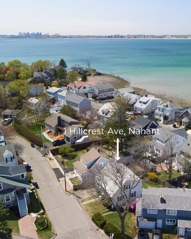 drone / aerial view featuring a water view and a residential view