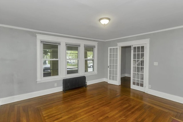 80 Rochelle St, Springfield, MA 01109 - empty room with radiator heating unit, french doors, ornamental molding, baseboards, and wood finished floors