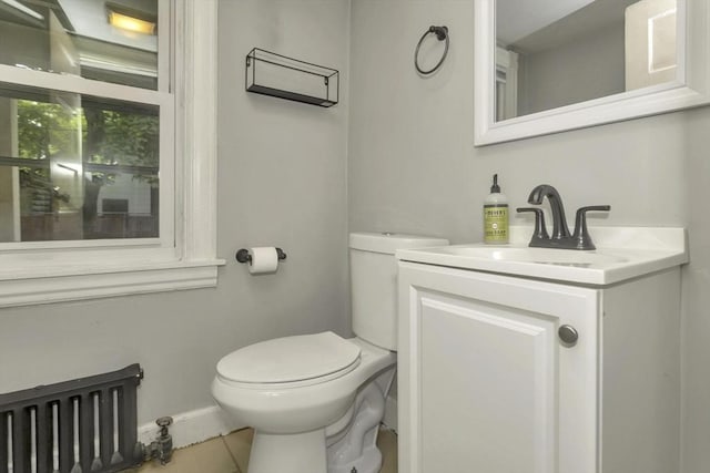 80 Rochelle St, Springfield, MA 01109 - half bathroom with toilet, vanity, baseboards, radiator, and tile patterned floors