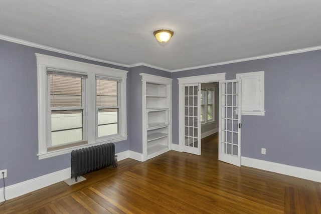80 Rochelle St, Springfield, MA 01109 - unfurnished room with radiator heating unit, french doors, baseboards, wood finished floors, and ornamental molding