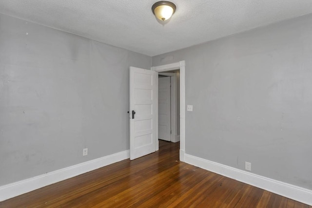 80 Rochelle St, Springfield, MA 01109 - empty room featuring wood finished floors, baseboards, and a textured ceiling