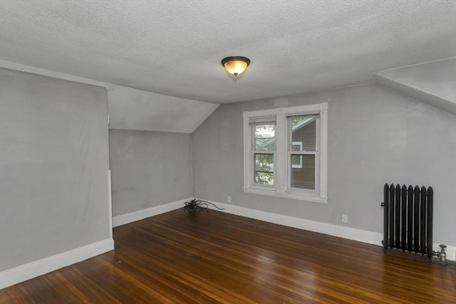80 Rochelle St, Springfield, MA 01109 - bonus room featuring radiator heating unit, hardwood / wood-style flooring, a textured ceiling, lofted ceiling, and baseboards