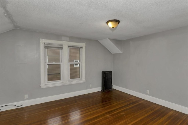 80 Rochelle St, Springfield, MA 01109 - additional living space with radiator, wood finished floors, a textured ceiling, lofted ceiling, and baseboards