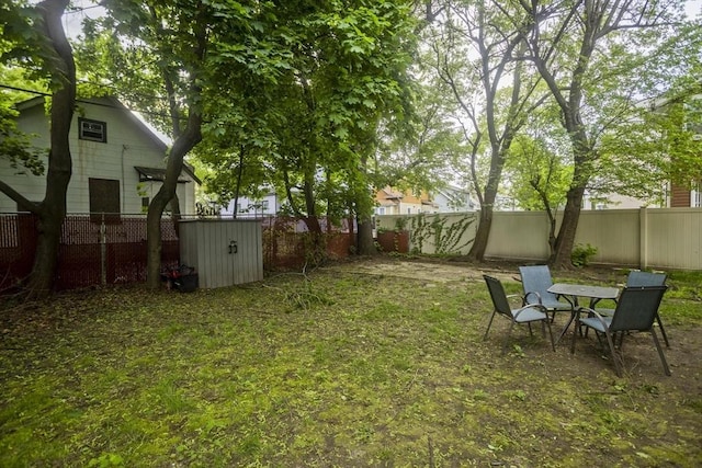 80 Rochelle St, Springfield, MA 01109 - fenced backyard with a storage unit and an outdoor structure