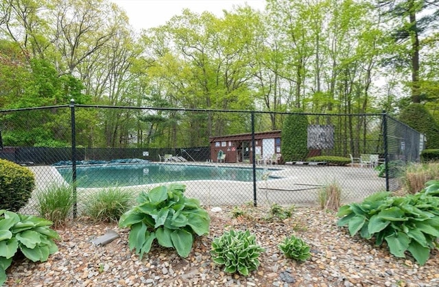 view of sport court featuring fence