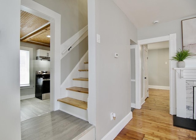 stairway with hardwood / wood-style flooring