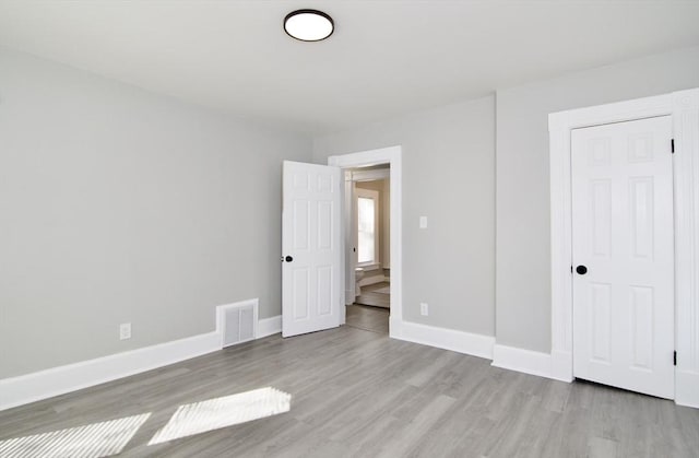 unfurnished bedroom featuring light hardwood / wood-style floors