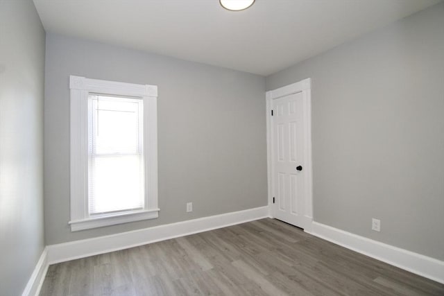 empty room with hardwood / wood-style floors