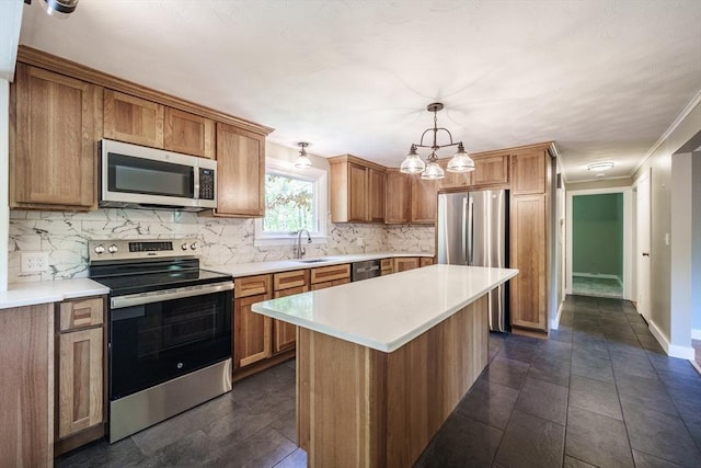 313 Bennett Rd, Hampden, MA 01036 - kitchen with appliances with stainless steel finishes, backsplash, a sink, light countertops, and crown molding