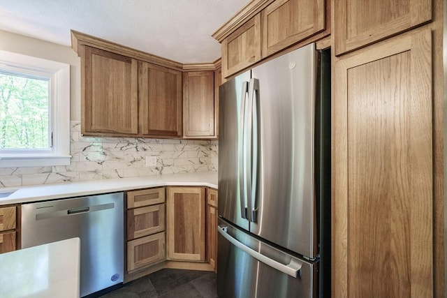 313 Bennett Rd, Hampden, MA 01036 - kitchen featuring appliances with stainless steel finishes, backsplash, light countertops, and brown cabinetry