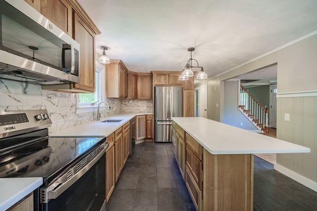 313 Bennett Rd, Hampden, MA 01036 - kitchen with appliances with stainless steel finishes, a sink, decorative backsplash, a center island, and brown cabinets